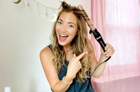 3. Use a curling iron to style your curtain bangs