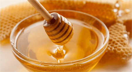 a-glass-bowl-of-raw-honey