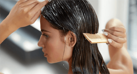 a-woman-using-comb-applying-hair-masks