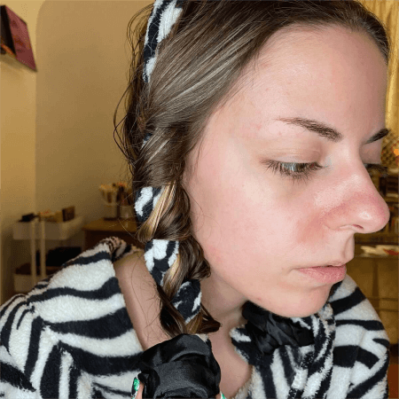 a-woman-using-satin-scarves-to-make-heatless-curls