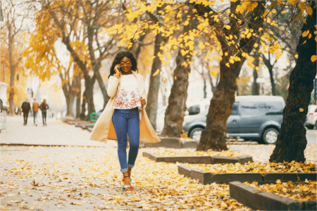 a-woman-walking-in-autumn-streets