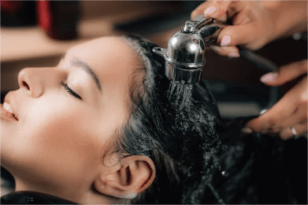 a-woman-washing-her-scalp