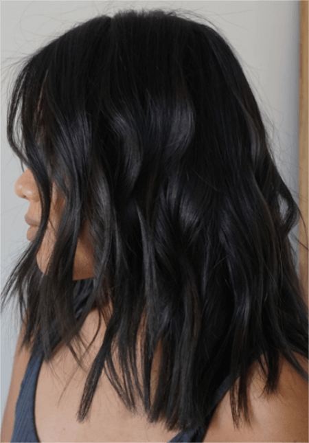a-woman-with-mid-length-dark-glossing-hair