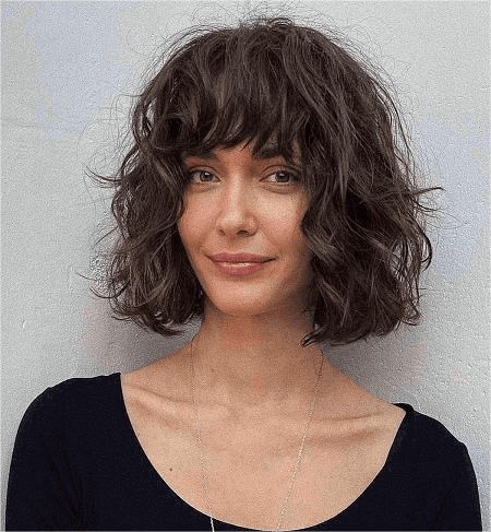 a_girl_with_messy_waves_and_bangs