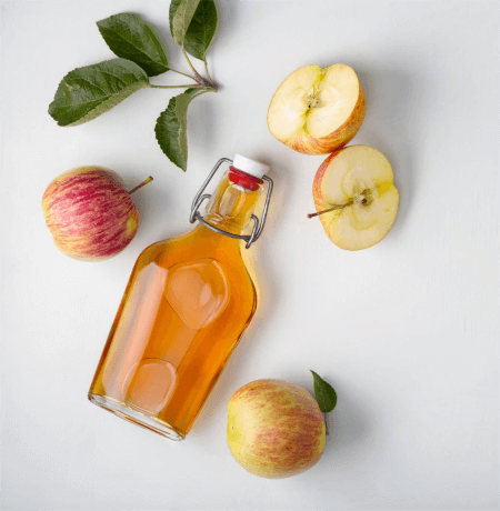 three-apples-with-a-bottle-of-apple-cider-vinegar