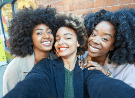 three-women-with-curly-or-coily-hair