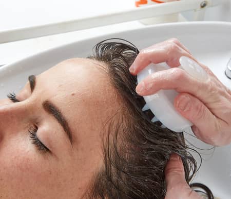 How to exfoliate the scalp with a brush?